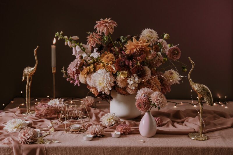 a bouquet of flowers in a vase on a table